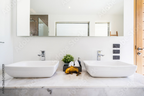 Modern bathroom, sinkm shower, and bathtub in luxury villa