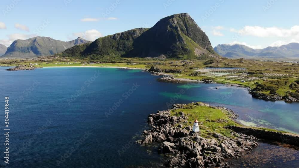 Lighthouse at Hovsund fishing port, Gimsoya Lofoten Islands in Norway. Aerial view Lighthouse at Hovsund fishing port, Gimsoya Lofoten Islands in Norway. Aerial view
