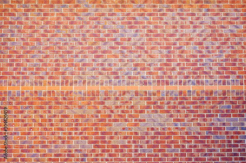 red brick wall texture on new build building in england uk