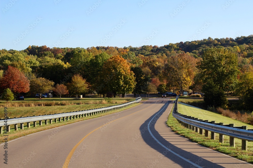 The winding country road on a bright sunny fall day.