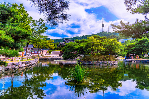 Namsangol Hannok Village and Seoul Tower Located on Namsan Mountain at night in Seoul,South Korea. photo