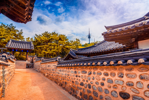 Namsangol Hannok Village and Seoul Tower Located on Namsan Mountain at night in Seoul,South Korea.