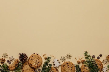 Christmas background with Chocolate chip cookies and wooden decorations