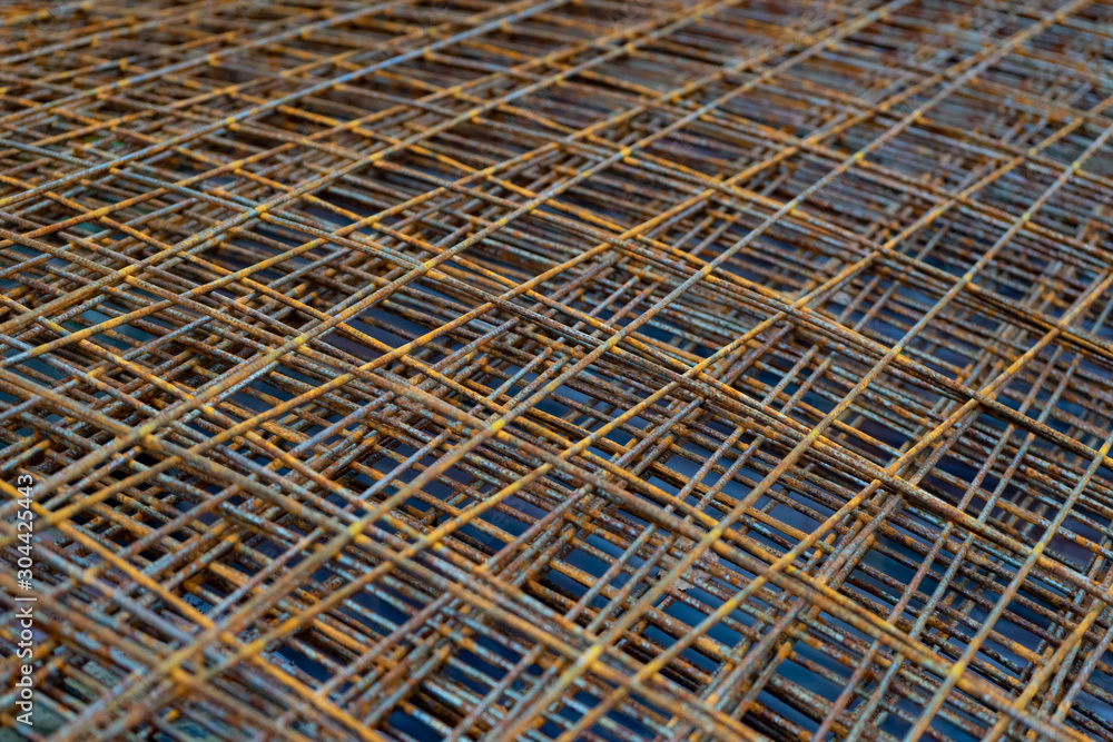 A pile of old rusty rebar, grill. Rusty metal bars. A pile of old rusty rebar, grill. Rusty metal bars.