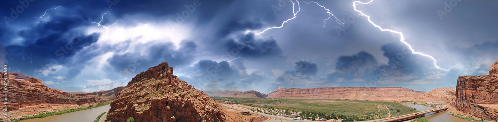 Panoramic aerial view of Colorado River in Moab area close to Arches National Park during a storm
