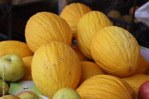 closeup of yellow melons exposed to the market