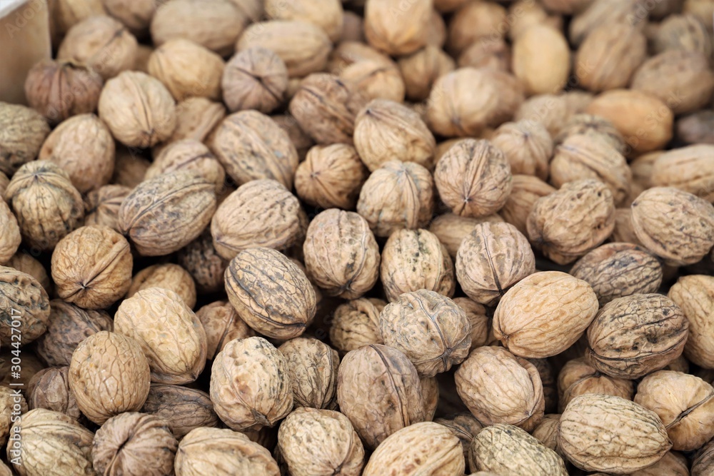 closeup of walnuts on display at the market closeup of walnuts on display at the market