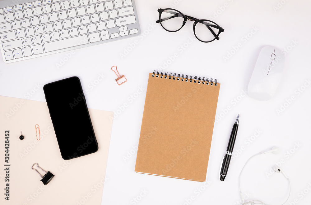 Hipster lifestyle desk with a computer keyboard, black cellphone screen mockup, spiral notepad and stationery. Responsive site screenshot mockup Hipster lifestyle desk with a computer keyboard, black cellphone screen mockup, spiral notepad and stationery. Responsive site screenshot mockup