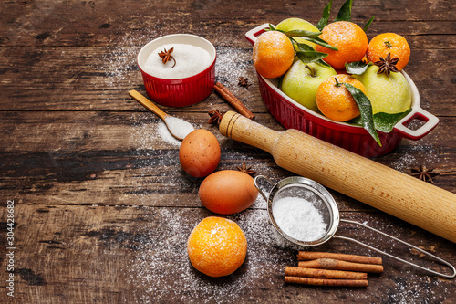 Christmas baking background. Raw ingredients for cooking xmas baking. Vintage wooden table