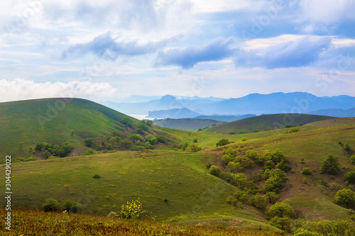 summer landscape with mountains valley and sea