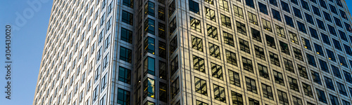 Canvas Print Modern city building architecture with glass fronts on a clear day at sunset in