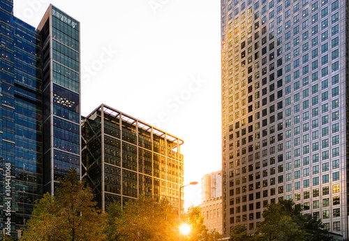 Modern city building architecture with glass fronts on a clear day at sunset in London  England