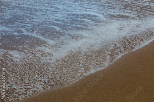 Foam on a dark sea surface