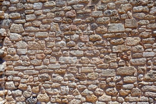 very old stone wall of stones  background