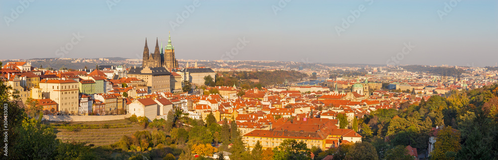 Prague - The panorama of the Town with the Castle and St. Vitus cathedral in evening light.