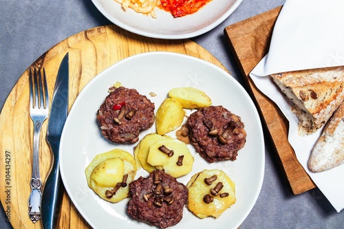 Cutlets with potatoes and mushrooms on a plate