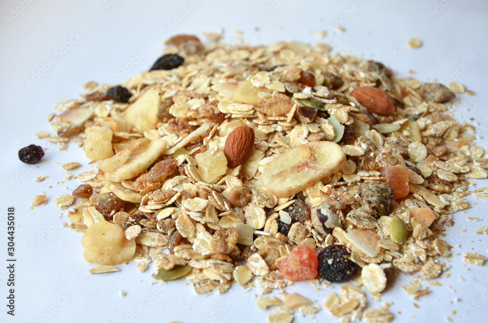 granola with fruits and nuts on a white background granola with fruits and nuts on a white background