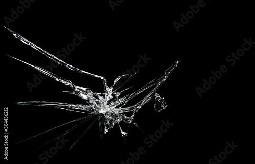 Obraz na płótnie crack on the glass mirror in the form of abstraction on a black background