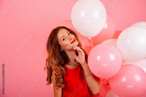 happy girl with balloons. color background, copy space 