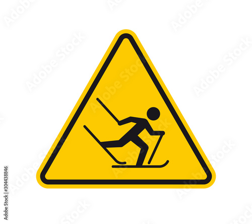 Vector yellow triangle sign - black silhouette figure cross country skiing. Isolated on white background.