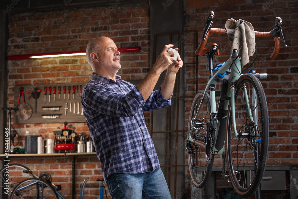 Mechanic or rider photographing a bicycle Mechanic or rider photographing a bicycle