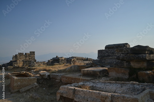 Old Hierapolis ruins  amphitheatre and touristic locations captured with hill background  in daytime.