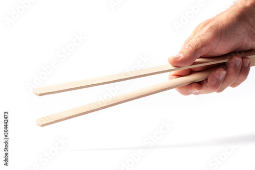 Grill Tongs in a Hand on White