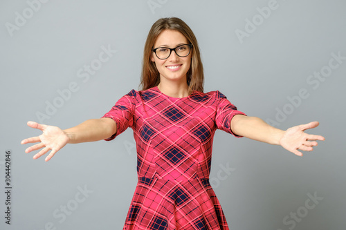 Woman smiling with open arms for hug
