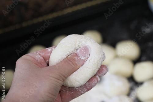 raw dough in hand, manicure and dough
