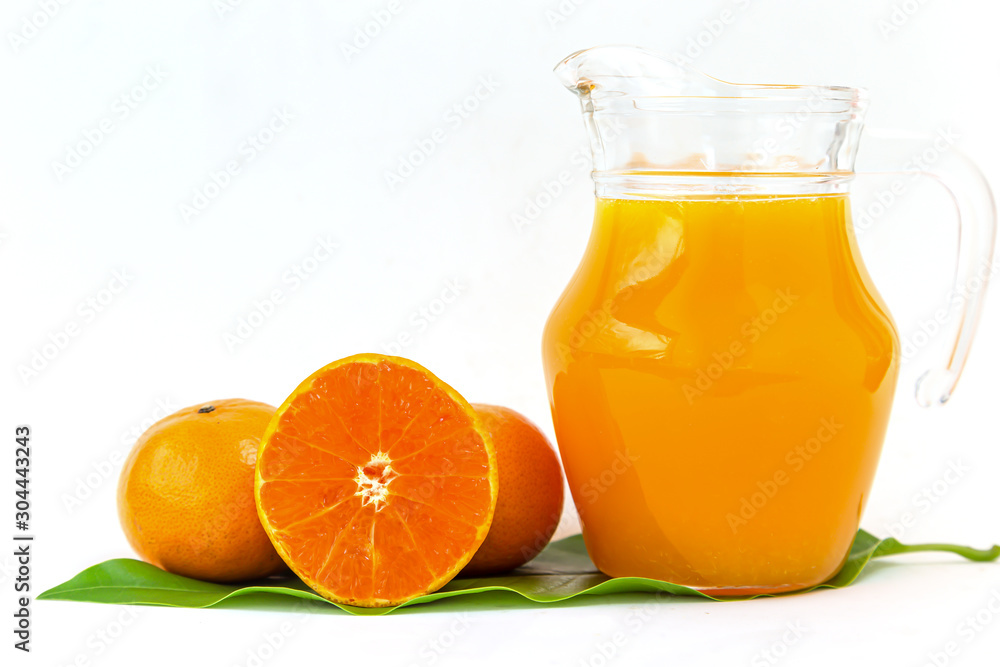Orange juice in a glass jar Set on the table, white background Orange juice in a glass jar Set on the table, white background