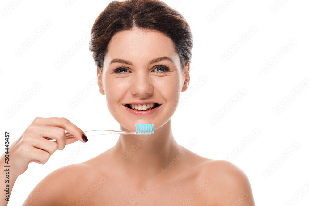 happy naked woman smiling while holding toothbrush isolated on white happy naked woman smiling while holding toothbrush isolated on white