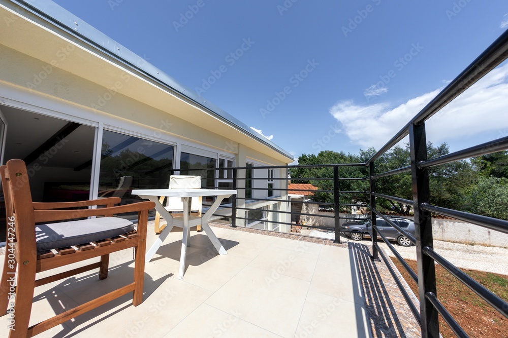 Balcony of modern building under blue sky