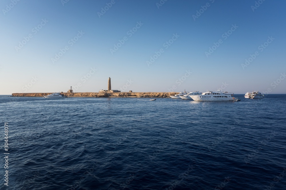 Tall lighthouse on the sea