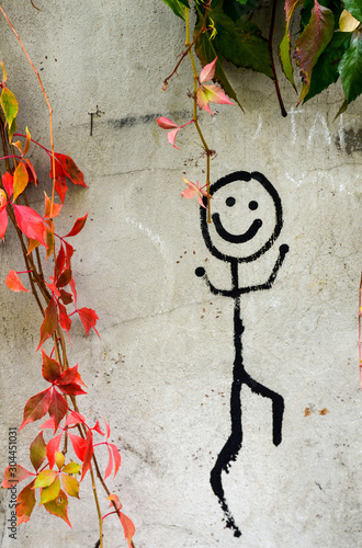 happy graffity on a wall in kraków old town