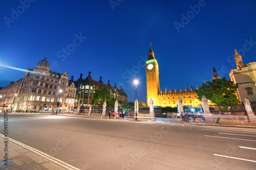 Night street traffic around Palace of Westminster, London, UK