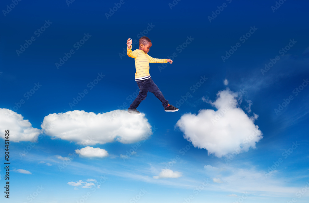 Little boy walking from one cloud to another Little boy walking from one cloud to another