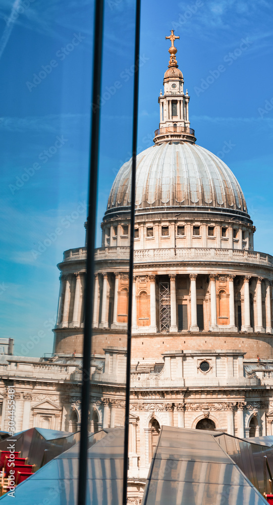 London St Paul Cathedral Dome with reflection on a modern building