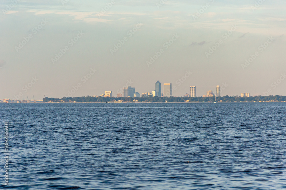 View of the city of Jacksonville, Florida, from the distance, while sailing on the Saint John's river on a sunny afternoon. United States