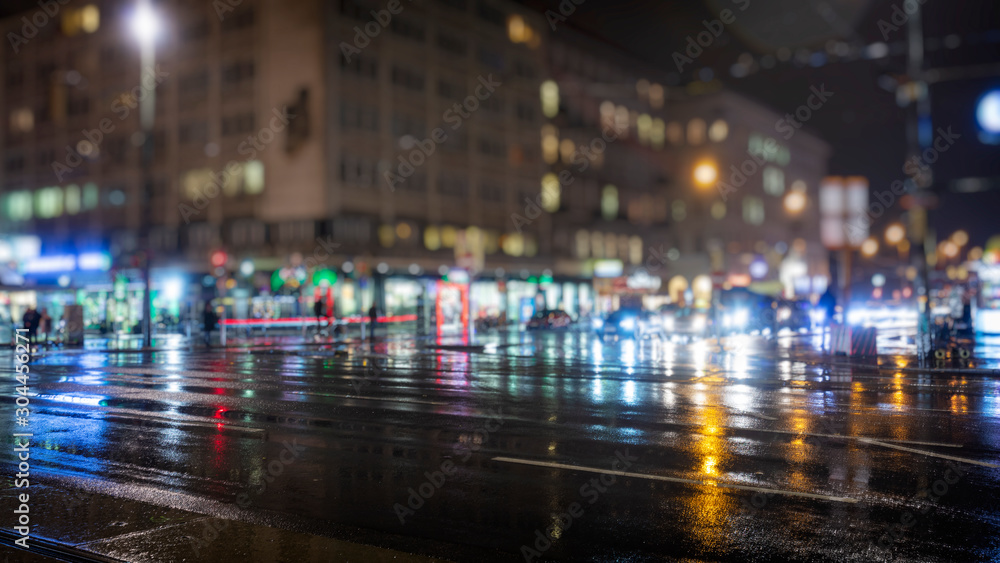 colorful traffic in the city on rainy night
