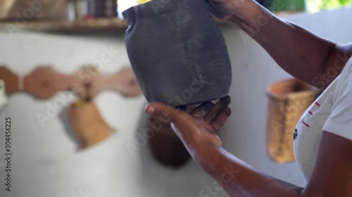 A woman makes pottery pieces photo