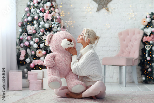 Young beautiful girl with pink bear