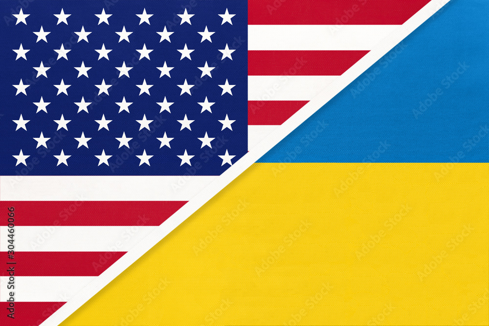 USA vs Ukraine national flag from textile. Relationship between american and european countries. USA vs Ukraine national flag from textile. Relationship between american and european countries.