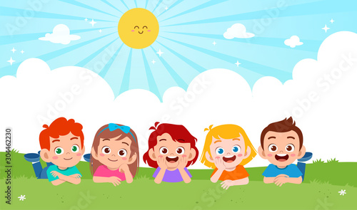 happy cute kid boy and girl lay on grass