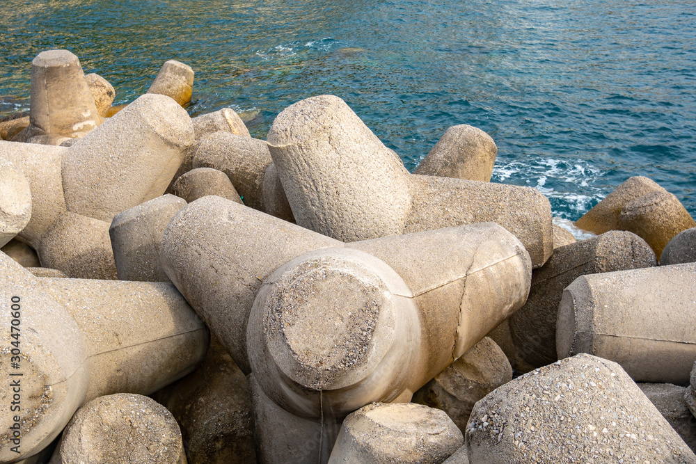 Breakwater of concrete tetrapods in Amalfi coastal town.