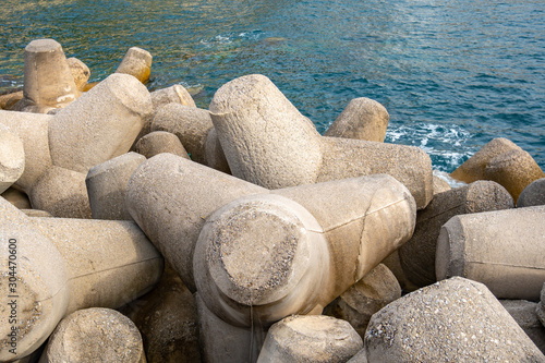 Breakwater of concrete tetrapods in Amalfi coastal town.