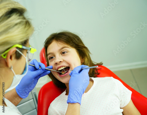 Dental treatment for a child in the dentist’s office.