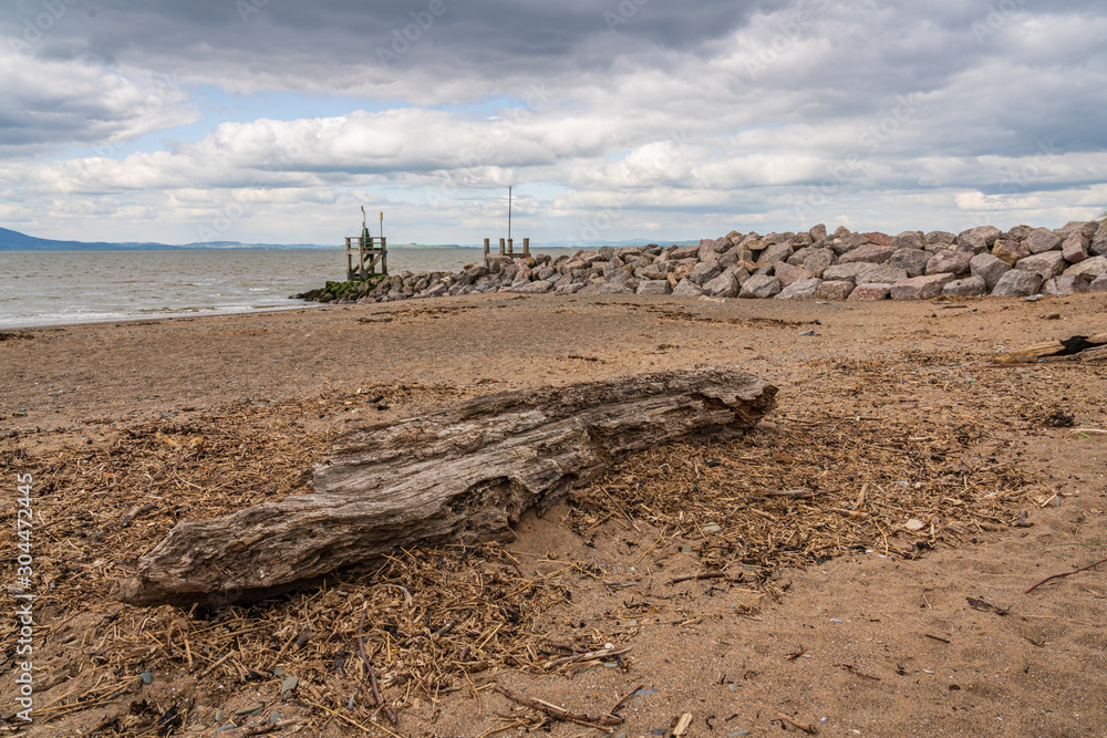 Driftwood on the West Beach in Silloth, Cumbria, England, UK