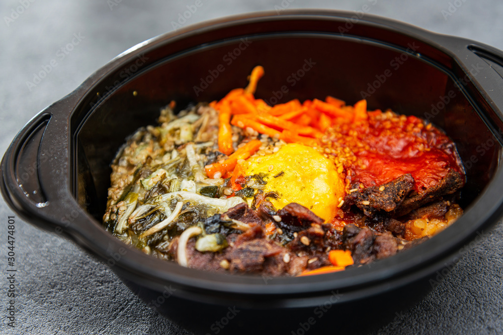 Bibimbap Rice, vegetables, minced marinated beef, spicy sauce and egg yolk Bibimbap Rice, vegetables, minced marinated beef, spicy sauce and egg yolk