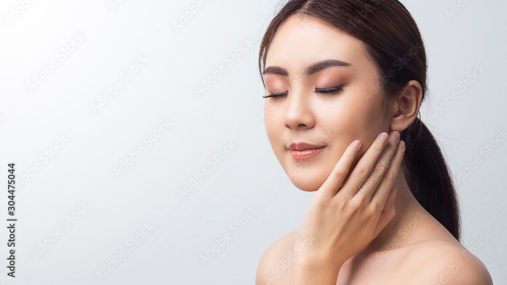 Close up, Face Asian woman close eye with hand touch on her face in studio white background. Portrait beautiful girl perfect skin make up. Close up, Face Asian woman close eye with hand touch on her face in studio white background. Portrait beautiful girl perfect skin make up.