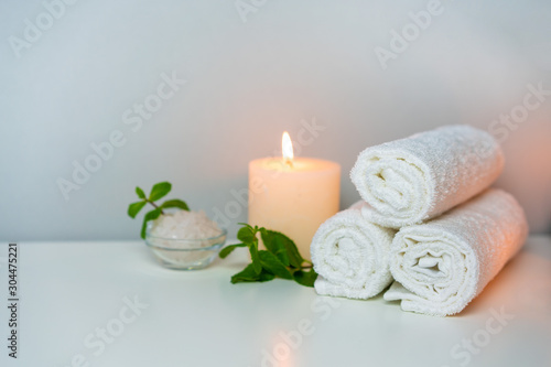 SPA   Massage salon photo with fresh towels  sea salt for bath and aroma candles.